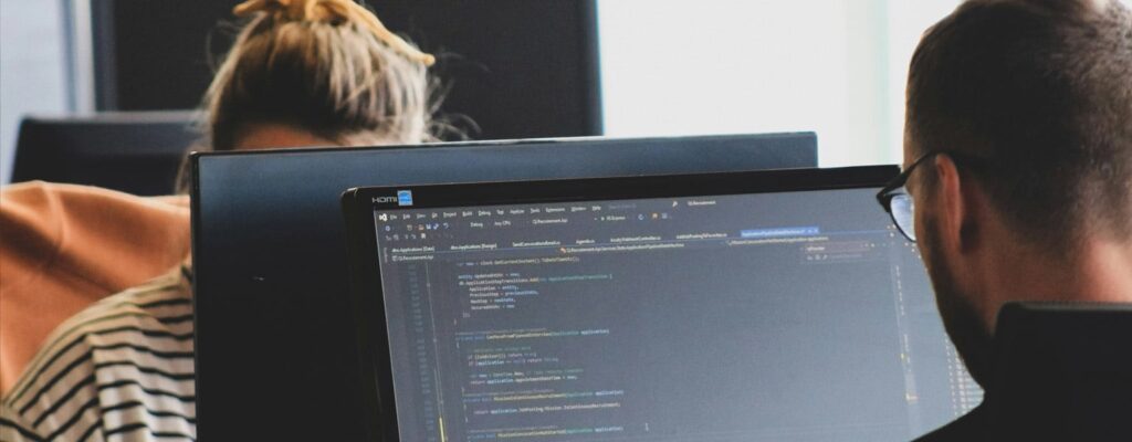 Two office workers utilizing a hybrid cloud computing setup