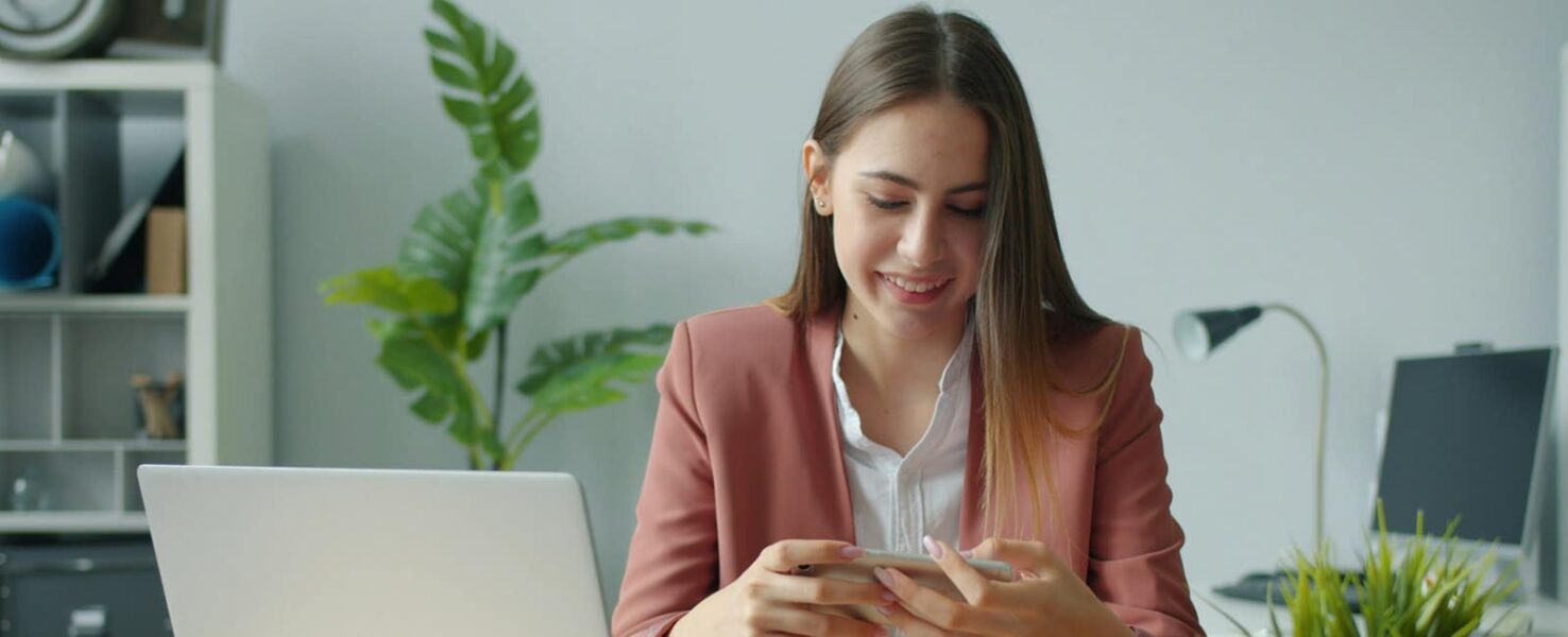 A woman on her cell phone while at work